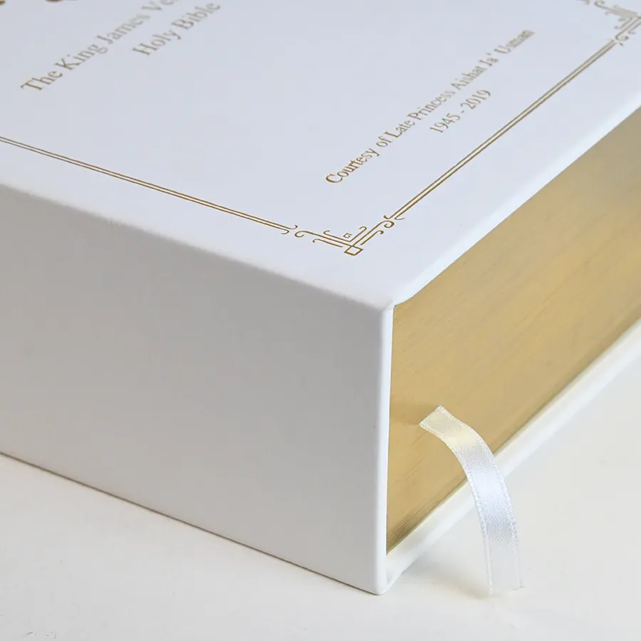 Presentation box with gold foil frame, gilded edges and ribbon